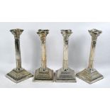 Two pairs of silver classical column candlesticks