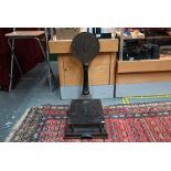 An antique set of brass-mounted cast iron platform scales