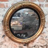 A 19th century moulded gilt framed convex mirror