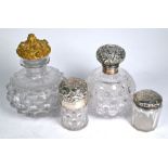 Silver-mounted tioilet bottles & ormolu -topped cologne bottle