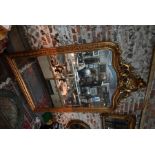 A very large Georgian style carved giltwood mirror,