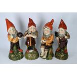 Four large Continental majolica garden gnomes 4)