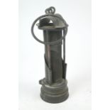 A 19th century brass miner's safety lamp