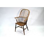 An antique style elm seat Windsor armchair