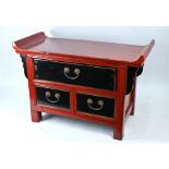 A small Chinese red and black lacquered altar top chest