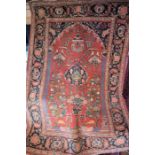 An antique Persian Kashan rug, 195 cm x 134 cm
