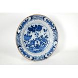 A 19th century Delft tin-glazed earthenware blue and white charger