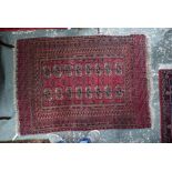 An old Turkoman red ground rug, with two rows of guls, 160 cm x 117 cm