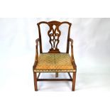 A George III mahogany framed open armchair