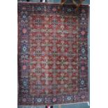 An antique Persian kashan rug, 194 cm x 134 cm