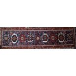 An old Persian Heriz runner, 390 cm x 110 cm