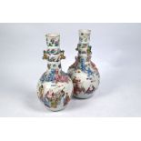 A pair of 19th century Chinese famille rose 'Eighteen Luohan' vases, Qing dynasty, 26 cm high