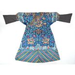 A Chinese blue ground nine dragon robe, late Qing dynasty