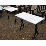 Two marble top cast iron base potting tables