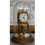 Glass-domed brass anniversary clock