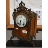 An American kingwood and brass mantel clock