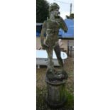 A large weathered cast stone classical male statue