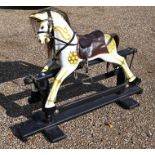 Modern rocking horse on wooden base