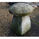 A single staddle stone and cap