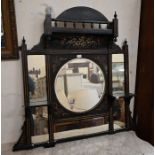 A Victorian Aesthetic period gilt traced and ebonized over-mantel mirror
