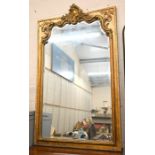 A large Victorian style gilt framed bevel edged overmantel mirror