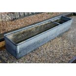 A large galvanized water trough