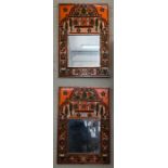 A pair of Black Forest style polychrome framed wall mirrors