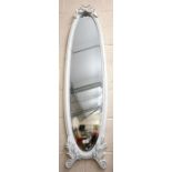 A narrow bevelled oval wall mirror