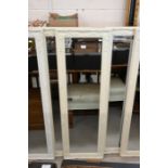 A pair of cream painted moulded framed mirrors