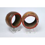 A pair of contemporary leather-bound terracotta heavy circular bracelets