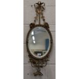 A bevelled oval girandole wall mirror