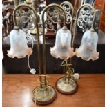 A pair of brass twin-sconce table lamps