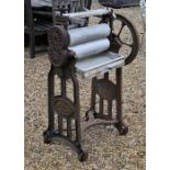 A vintage cast iron framed mangle