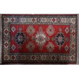 A Caucasian design red ground rug