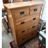A contemporary oak chest of drawers and bedside cabinet (2)