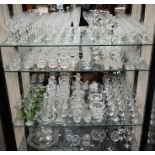 A large quantity of cut and moulded drinking glasses, table glass and ornaments
