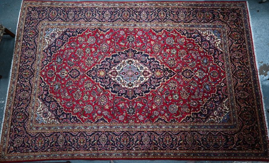 A Persian Kashan carpet, 380 cm x 245 cm