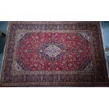 A Persian Kashan carpet, 380 cm x 245 cm