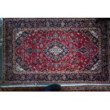 A Persian Kashan rug, 245 cm x 148 cm