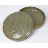 A Chinese celadon-glazed circular box and cover