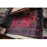 An old Persian red ground Shiraz carpet, 302 cmx 210 cm