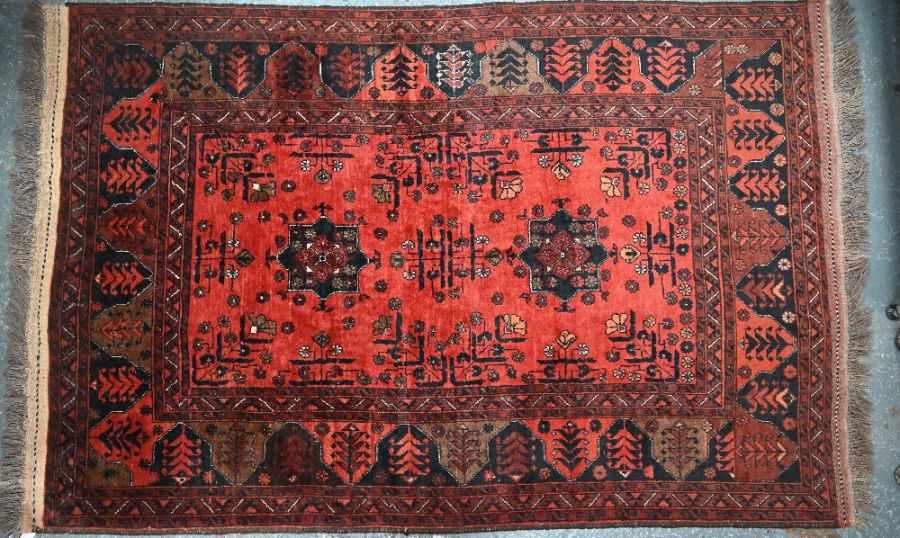 A vintage Persian-Kurd red ground rug, 191 cm x 126 cm