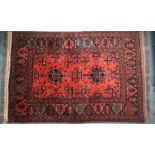A vintage Persian-Kurd red ground rug, 191 cm x 126 cm
