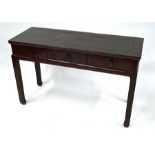 A 20th century Chinese lacquered elm three drawer side table on square legs