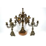 A five branch gilt metal candelabra to/w a pair of brass candelabra (3)