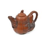A Chinese naturalistic gourd shaped Yixing teapot and cover