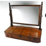 A Victorian mahogany bowfront toilet mirror