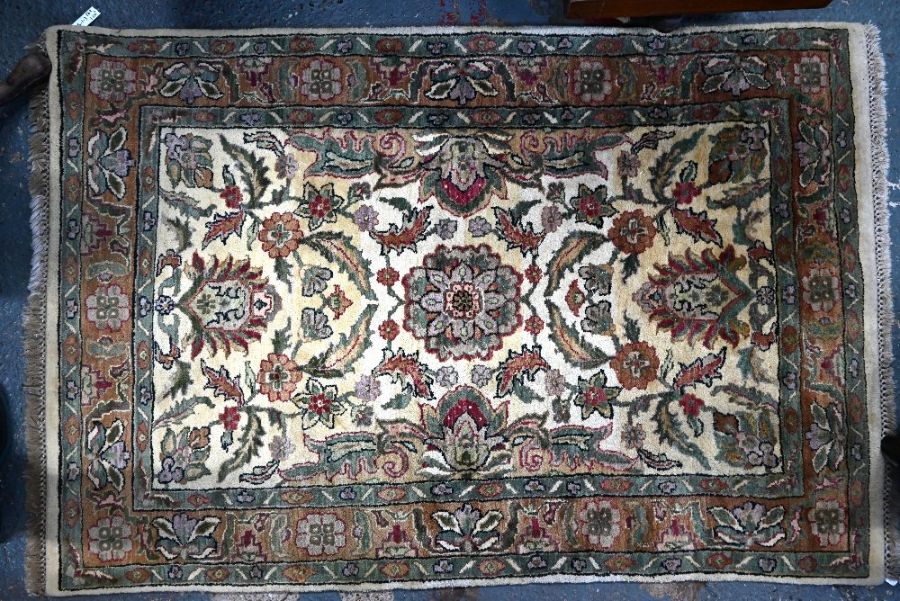 A contemporary camel ground Agra rug, 183 cm x 124 cm