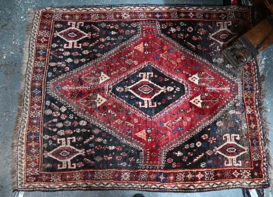 An old Persian Shiraz rug, 163 cm x 124 cm