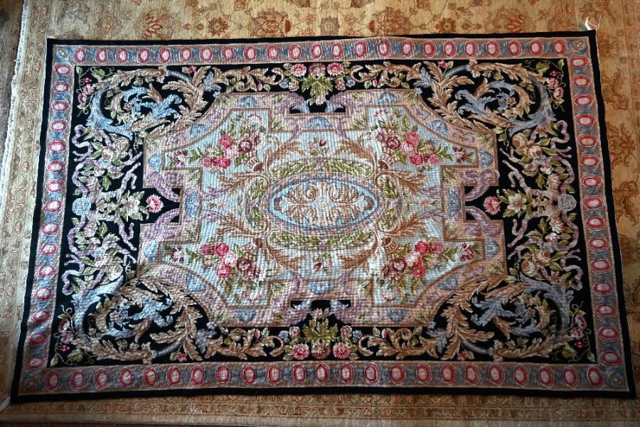 An Aubusson style needlepoint rug, 266 cm x 167 cm